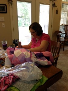 Carole sewing with her mom's Singer featherweight machine